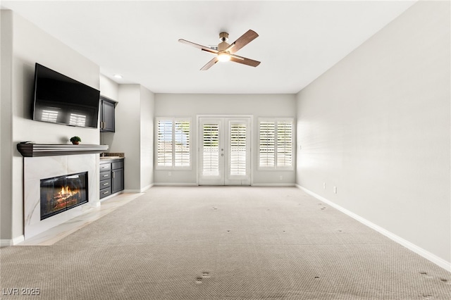 1800 Aztec Cliffs Ct, Las Vegas, NV 89128 - unfurnished living room featuring light colored carpet, ceiling fan, a fireplace, and recessed lighting