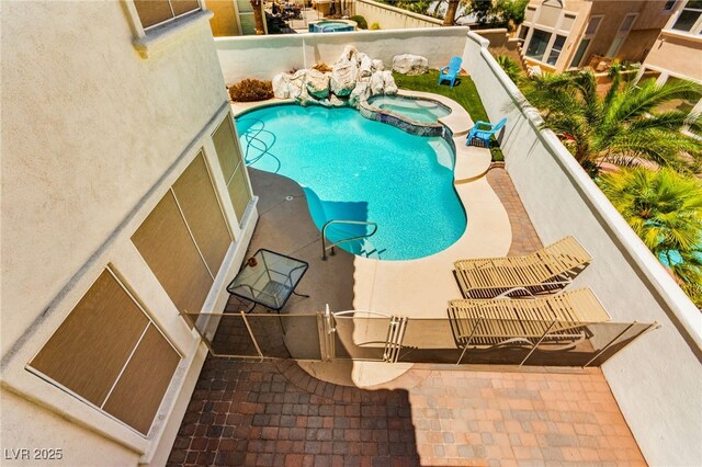 1800 Aztec Cliffs Ct, Las Vegas, NV 89128 - view of swimming pool featuring a pool with connected hot tub