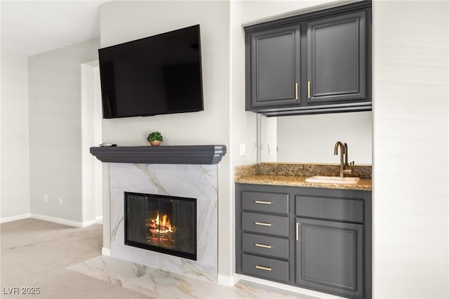 1800 Aztec Cliffs Ct, Las Vegas, NV 89128 - indoor wet bar with a high end fireplace and light colored carpet