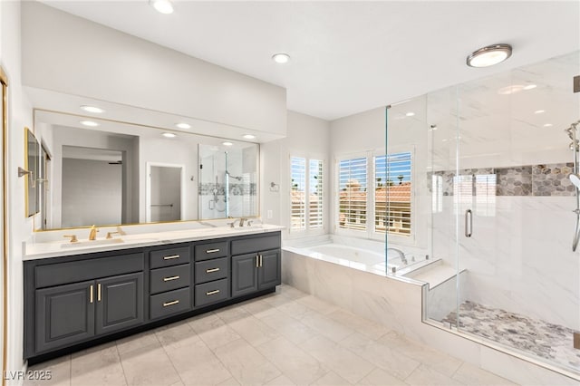 1800 Aztec Cliffs Ct, Las Vegas, NV 89128 - bathroom with a garden tub, double vanity, a marble finish shower, and recessed lighting