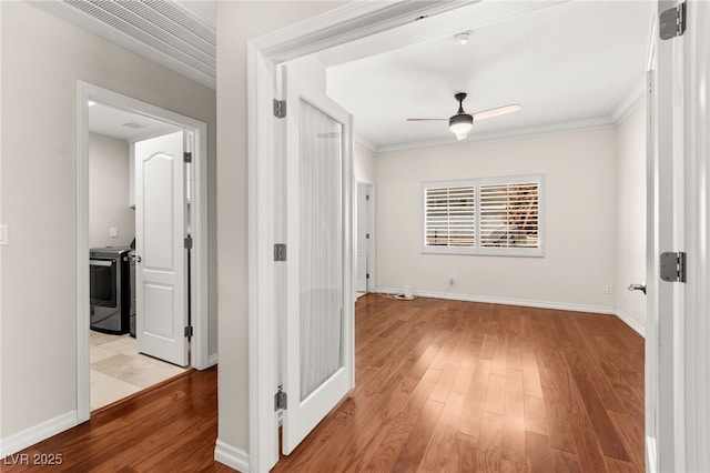 1800 Aztec Cliffs Ct, Las Vegas, NV 89128 - hall with light wood-type flooring and crown molding