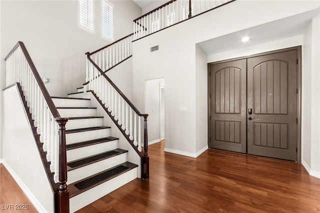 1800 Aztec Cliffs Ct, Las Vegas, NV 89128 - entryway with wood finished floors, stairs, and a towering ceiling