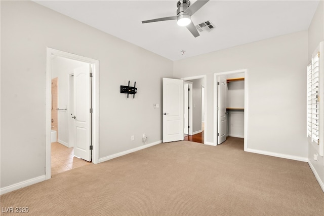 1800 Aztec Cliffs Ct, Las Vegas, NV 89128 - unfurnished bedroom with carpet, a walk in closet, ensuite bath, and a ceiling fan