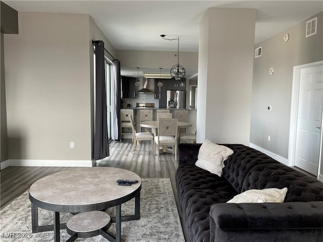 150 Las Vegas Blvd Unit 1115, Las Vegas, NV 89101 - living area with wood finished floors and a chandelier