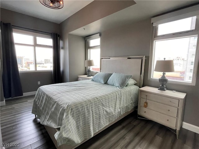 150 Las Vegas Blvd Unit 1115, Las Vegas, NV 89101 - bedroom with multiple windows and dark wood-type flooring