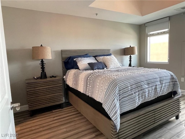 150 Las Vegas Blvd Unit 1115, Las Vegas, NV 89101 - bedroom featuring wood finished floors and baseboards