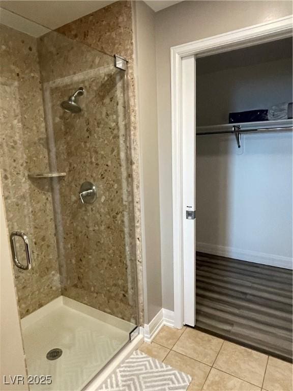 150 Las Vegas Blvd Unit 1115, Las Vegas, NV 89101 - full bathroom with tile patterned floors, a stall shower, and a spacious closet