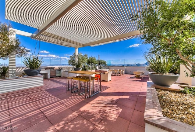 150 Las Vegas Blvd Unit 1115, Las Vegas, NV 89101 - view of patio with exterior kitchen, a pergola, and outdoor dining area