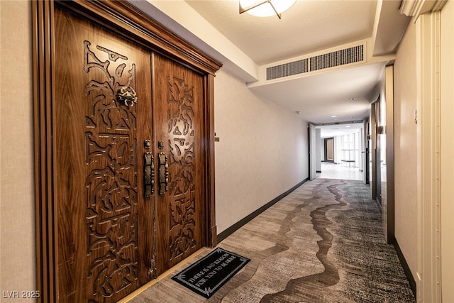 3111 Bel Air Dr Unit 9E, Las Vegas, NV 89109 - hallway with carpet and baseboards