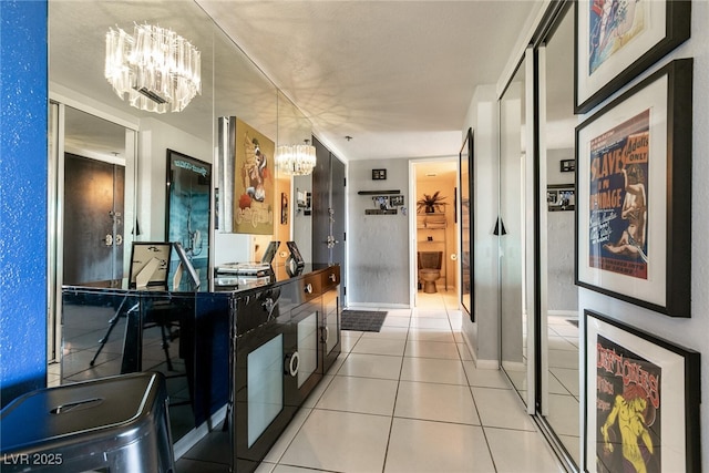 3111 Bel Air Dr Unit 9E, Las Vegas, NV 89109 - hall featuring a chandelier and tile patterned flooring