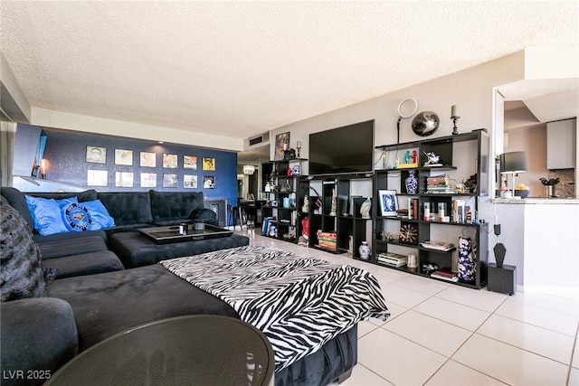 3111 Bel Air Dr Unit 9E, Las Vegas, NV 89109 - living room featuring light tile patterned floors and a textured ceiling