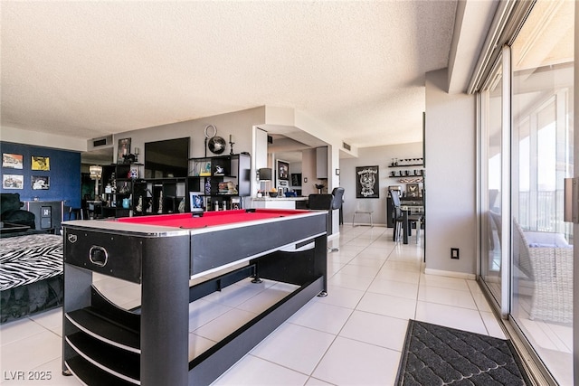 3111 Bel Air Dr Unit 9E, Las Vegas, NV 89109 - playroom with pool table, a textured ceiling, and light tile patterned floors