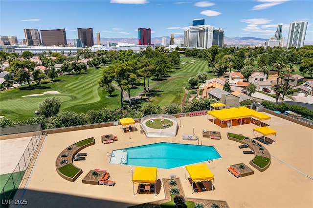 3111 Bel Air Dr Unit 9E, Las Vegas, NV 89109 - view of swimming pool featuring a view of skyline and view of golf course