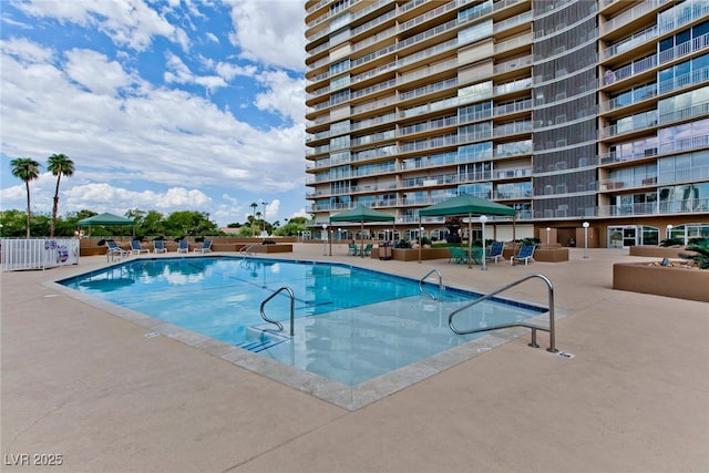 3111 Bel Air Dr Unit 9E, Las Vegas, NV 89109 - community pool featuring a patio