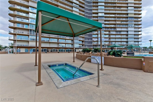 3111 Bel Air Dr Unit 9E, Las Vegas, NV 89109 - view of pool with a community hot tub and a gazebo