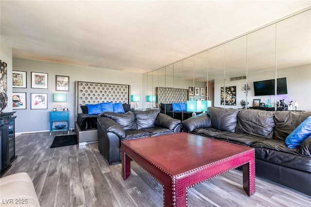 3111 Bel Air Dr Unit 9E, Las Vegas, NV 89109 - living room with wood finished floors