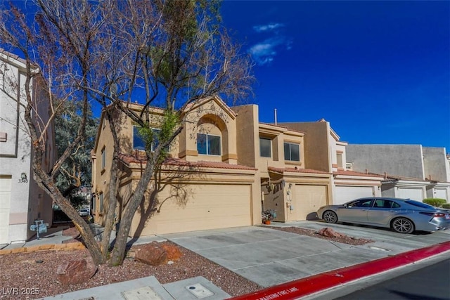 3336 Cheyenne Gardens Way N, Las Vegas, NV 89032 - view of front of home with stucco siding, concrete driveway, and a garage