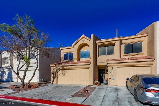 3336 Cheyenne Gardens Way N, Las Vegas, NV 89032 - townhome / multi-family property with a garage, concrete driveway, stucco siding, and a tiled roof