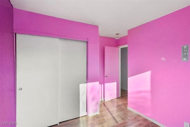 3336 Cheyenne Gardens Way N, Las Vegas, NV 89032 - unfurnished bedroom with a closet and wood finished floors