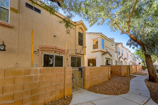 3336 Cheyenne Gardens Way N, Las Vegas, NV 89032 - view of building exterior with a fenced front yard