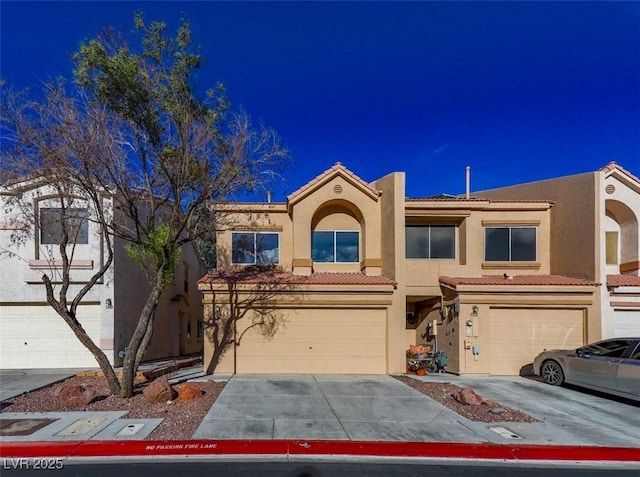 3336 Cheyenne Gardens Way N, Las Vegas, NV 89032 - multi unit property with driveway, a tile roof, stucco siding, and an attached garage