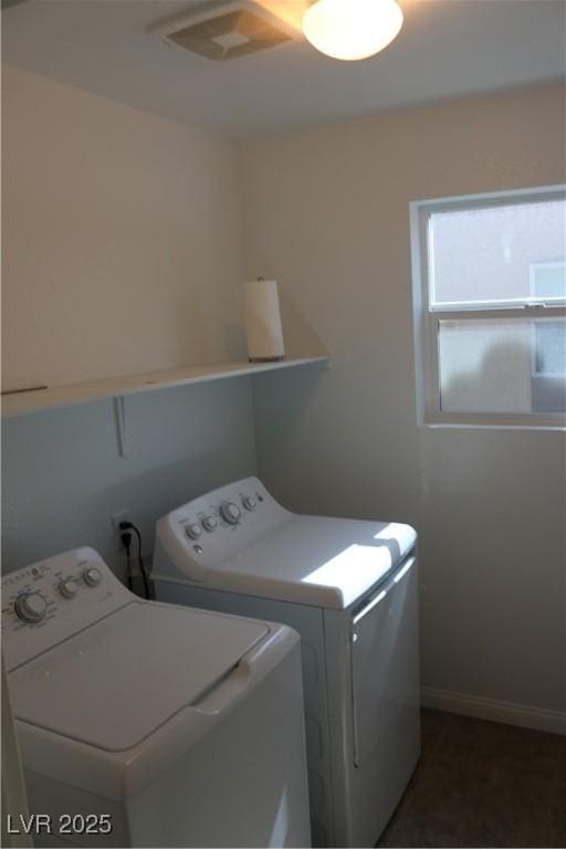 2102 Stone Well Rd, North Las Vegas, NV 89031 - laundry room with washing machine and clothes dryer and baseboards
