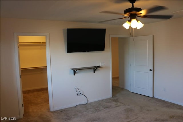 2102 Stone Well Rd, North Las Vegas, NV 89031 - unfurnished bedroom with a spacious closet, carpet, and ceiling fan
