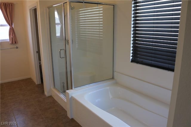 2102 Stone Well Rd, North Las Vegas, NV 89031 - full bathroom featuring a shower stall, a garden tub, and tile patterned floors