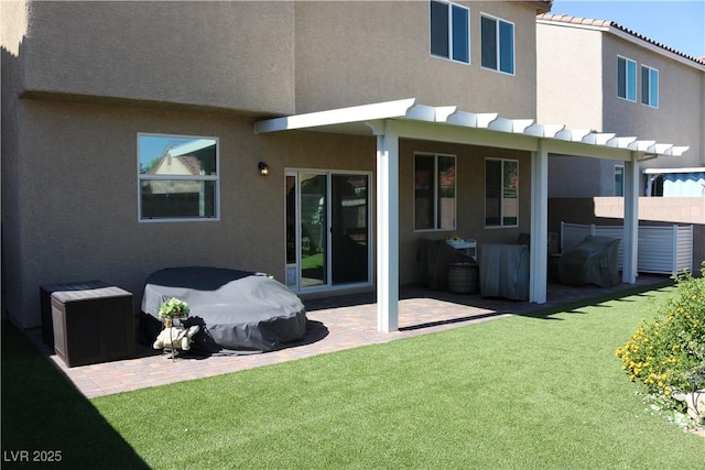 2102 Stone Well Rd, North Las Vegas, NV 89031 - rear view of property featuring a patio area and stucco siding
