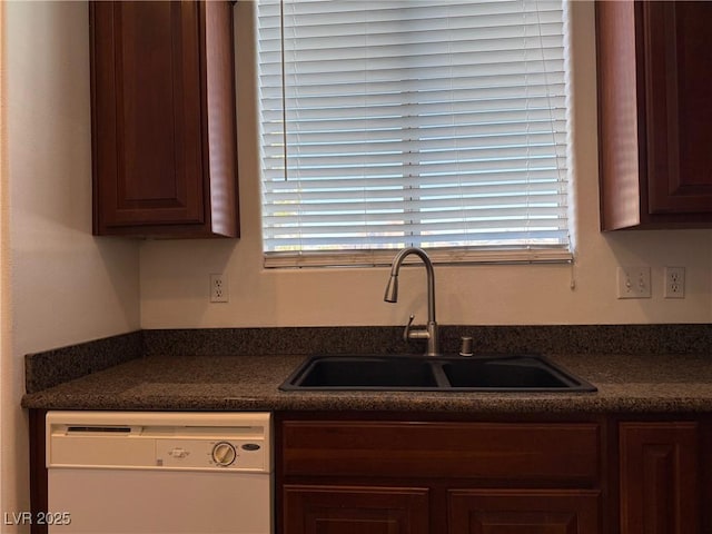 5905 Addy Ln, North Las Vegas, NV 89081 - kitchen featuring white dishwasher, dark countertops, and plenty of natural light