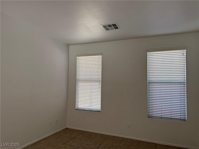 5905 Addy Ln, North Las Vegas, NV 89081 - tiled spare room with baseboards