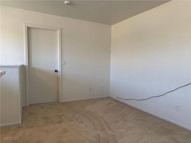5905 Addy Ln, North Las Vegas, NV 89081 - carpeted empty room featuring a smoke detector and baseboards