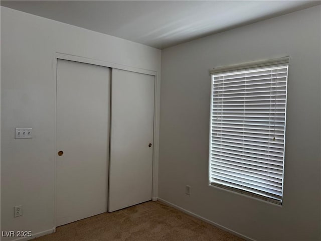 5905 Addy Ln, North Las Vegas, NV 89081 - unfurnished bedroom featuring carpet flooring and a closet