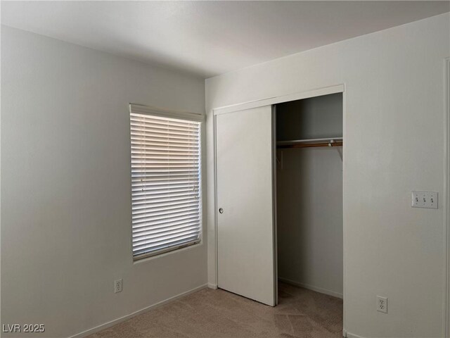 5905 Addy Ln, North Las Vegas, NV 89081 - unfurnished bedroom with carpet and a closet