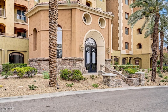 15 Via Mantova Unit 208, Henderson, NV 89011 - view of front of home featuring stucco siding and stone siding