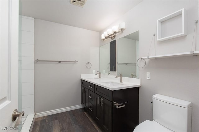 2610 Gardenia Flower Ave, North Las Vegas, NV 89031 - bathroom featuring wood finished floors and double vanity