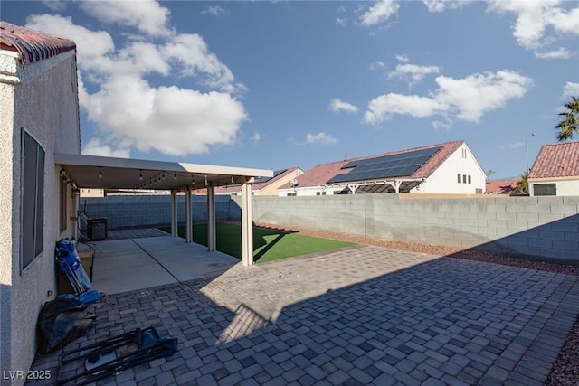2610 Gardenia Flower Ave, North Las Vegas, NV 89031 - fenced backyard with a patio area