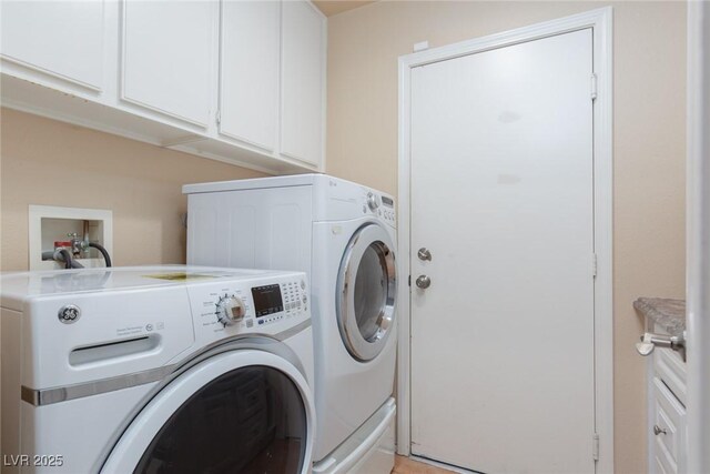 2610 Gardenia Flower Ave, North Las Vegas, NV 89031 - washroom featuring washing machine and clothes dryer and cabinet space
