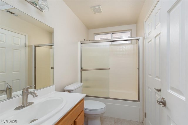 2610 Gardenia Flower Ave, North Las Vegas, NV 89031 - bathroom featuring vanity, enclosed tub / shower combo, and tile patterned floors