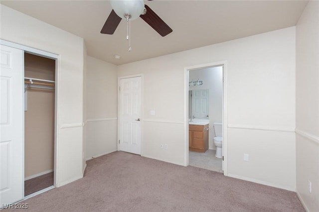 2610 Gardenia Flower Ave, North Las Vegas, NV 89031 - unfurnished bedroom featuring light carpet, ensuite bath, a closet, and a ceiling fan