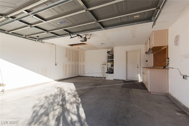 2610 Gardenia Flower Ave, North Las Vegas, NV 89031 - garage featuring a garage door opener and strapped water heater