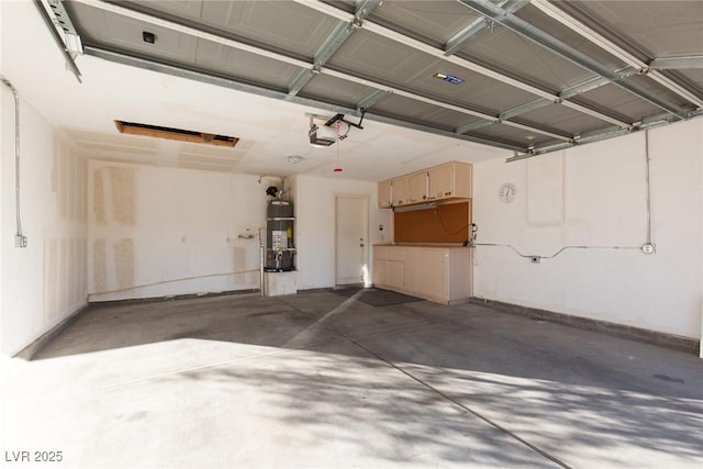 2610 Gardenia Flower Ave, North Las Vegas, NV 89031 - garage featuring water heater and a garage door opener