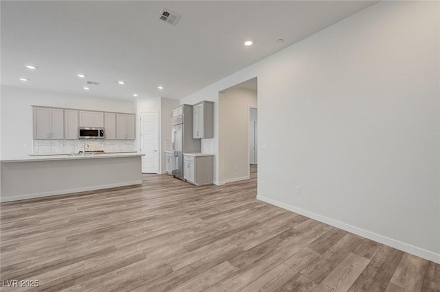 12436 Primrose Grove Ln, Las Vegas, NV 89138 - unfurnished living room with light wood-style floors and recessed lighting