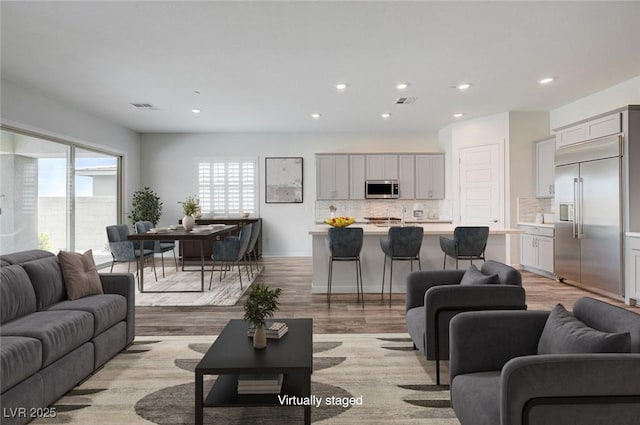12436 Primrose Grove Ln, Las Vegas, NV 89138 - living room featuring recessed lighting and light wood-style flooring