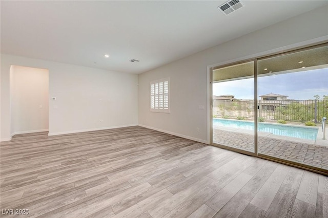 12436 Primrose Grove Ln, Las Vegas, NV 89138 - spare room featuring light wood-style flooring and recessed lighting