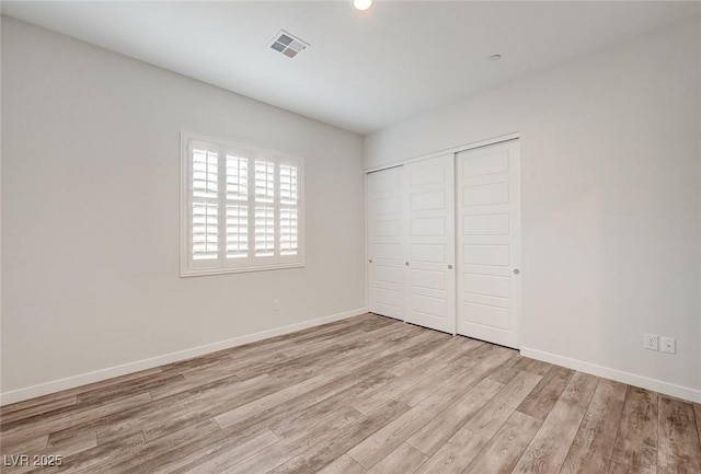 12436 Primrose Grove Ln, Las Vegas, NV 89138 - unfurnished bedroom with light wood-style flooring, a closet, and recessed lighting