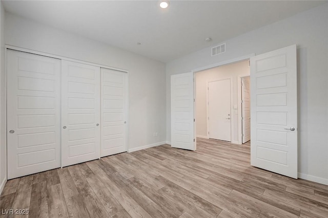 12436 Primrose Grove Ln, Las Vegas, NV 89138 - unfurnished bedroom with a closet, light wood-style flooring, and recessed lighting