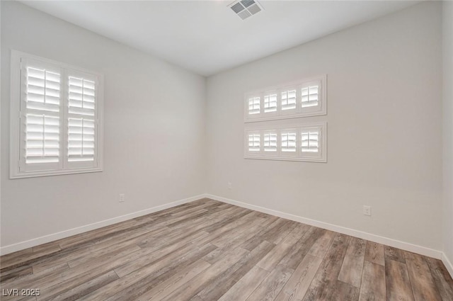 12436 Primrose Grove Ln, Las Vegas, NV 89138 - empty room featuring wood finished floors and baseboards