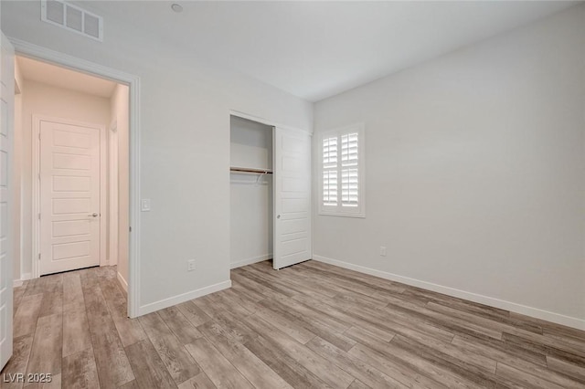 12436 Primrose Grove Ln, Las Vegas, NV 89138 - unfurnished bedroom with light wood-style floors and a closet
