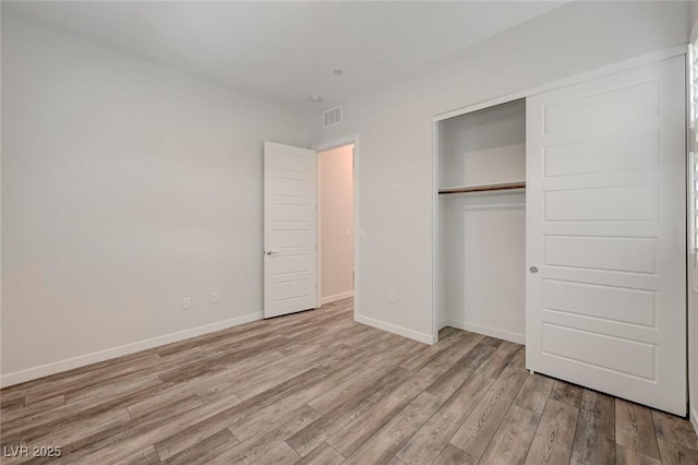 12436 Primrose Grove Ln, Las Vegas, NV 89138 - unfurnished bedroom featuring wood finished floors and a closet